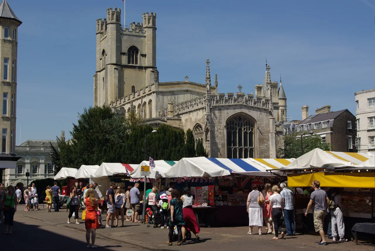Market Square in Cambridge with market stalls and the surrounding historic buildings