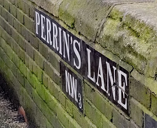The tiled Perrin’s Lane street sign in Hampstead, photographed in February 2026